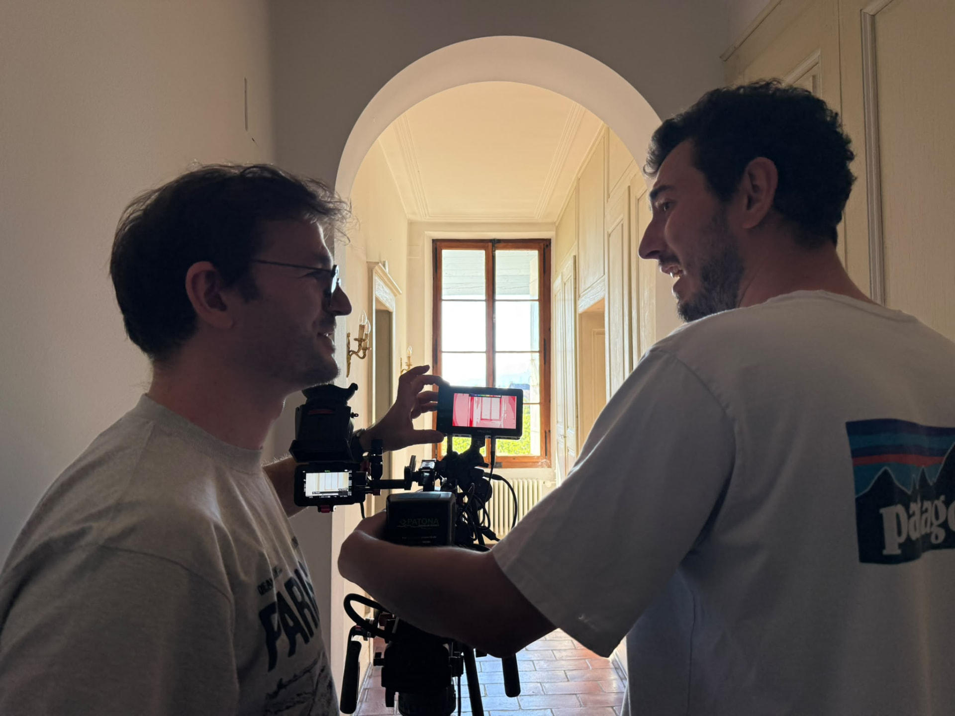 Camera crew preparing a shot inside the house